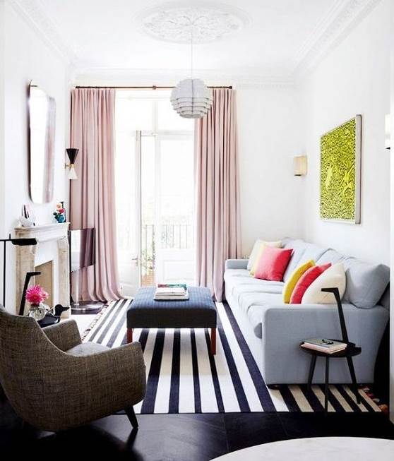 Pink curtains and a patterned furnishing scheme