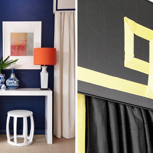 Decorative pelmet detail with contrasting trim above a curtain