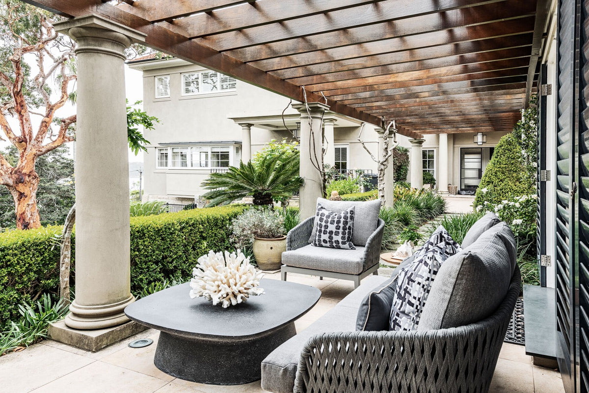 Covered terrace with upholstered outdoor seating