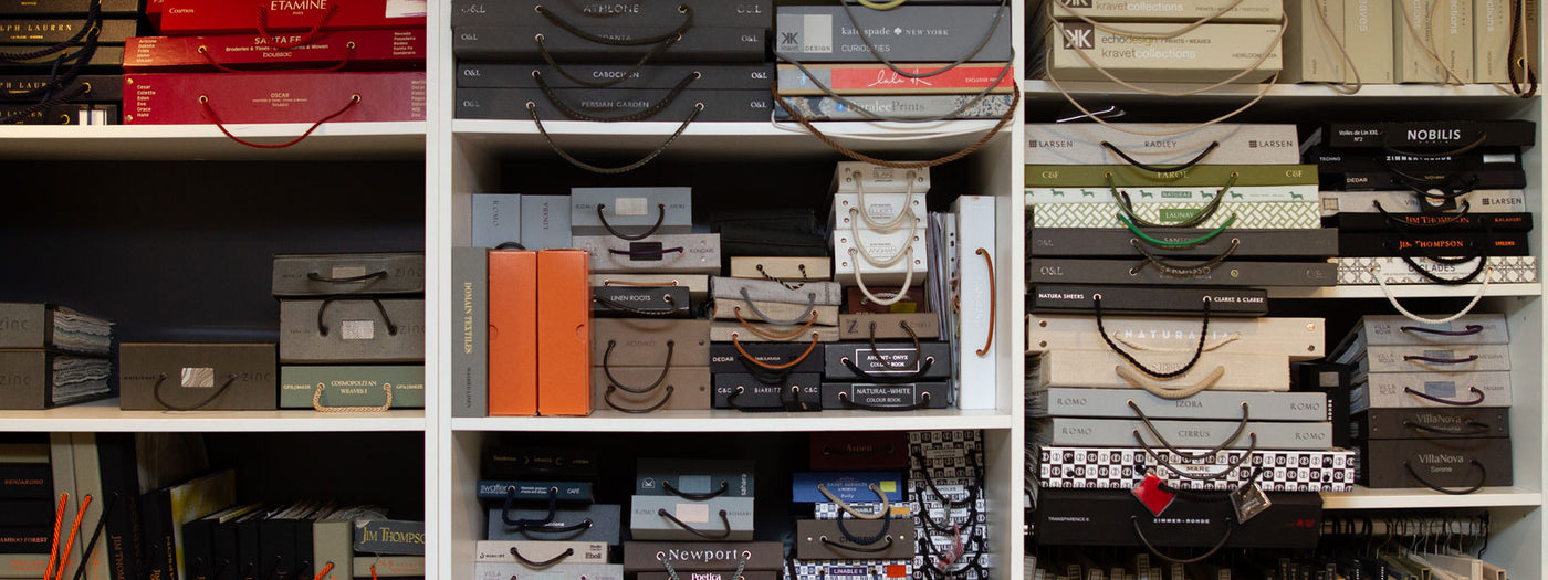 Shelves of fabric and decorating sample books in Tempo’s studio library.