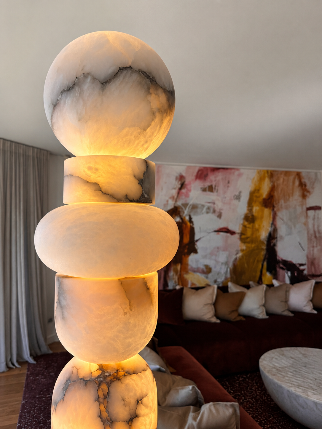 Close view of an illuminated lamp with rounded pale forms and dark veining