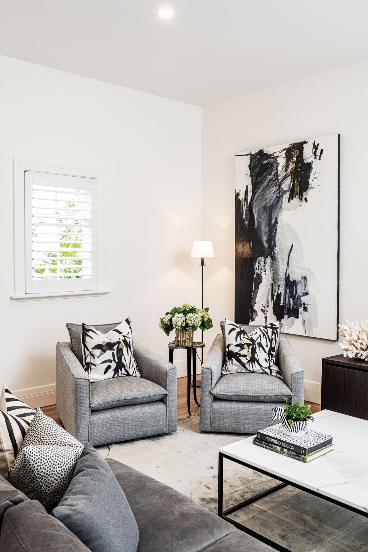 Light living room with upholstered seating and framed artwork